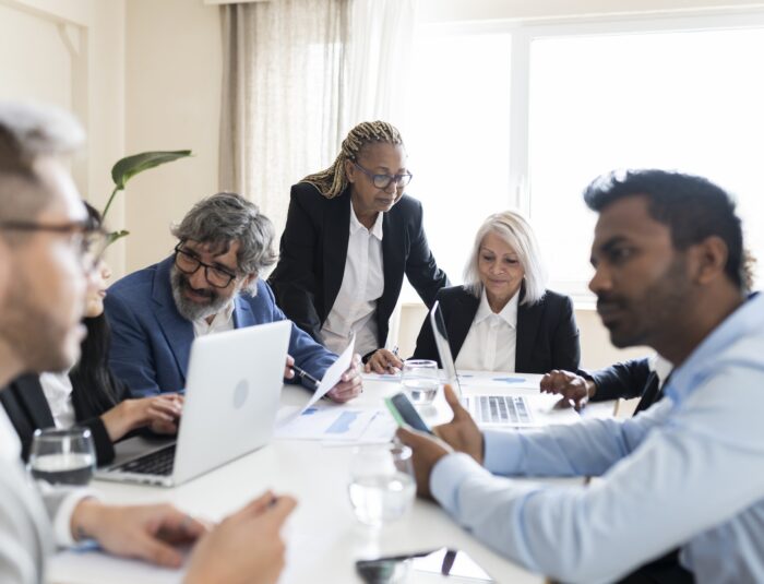 multiracial work group, people of different ages working together in the office